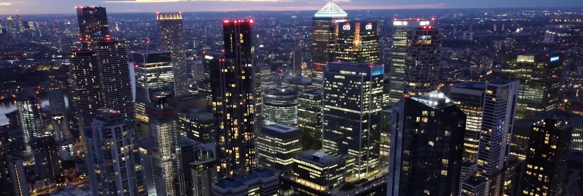 Financial district skyline of towers lit up at night